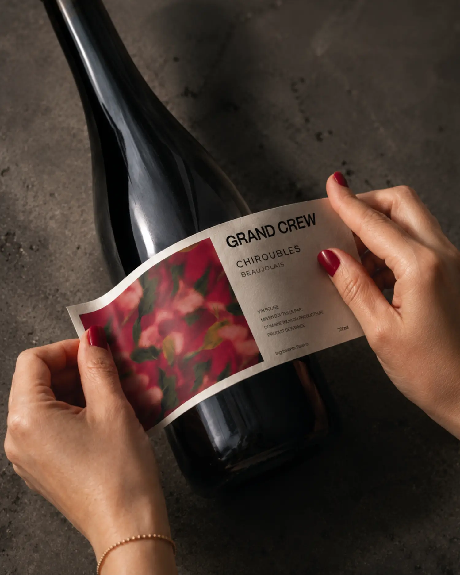 Grand Crew Chiroubles label being applied during production