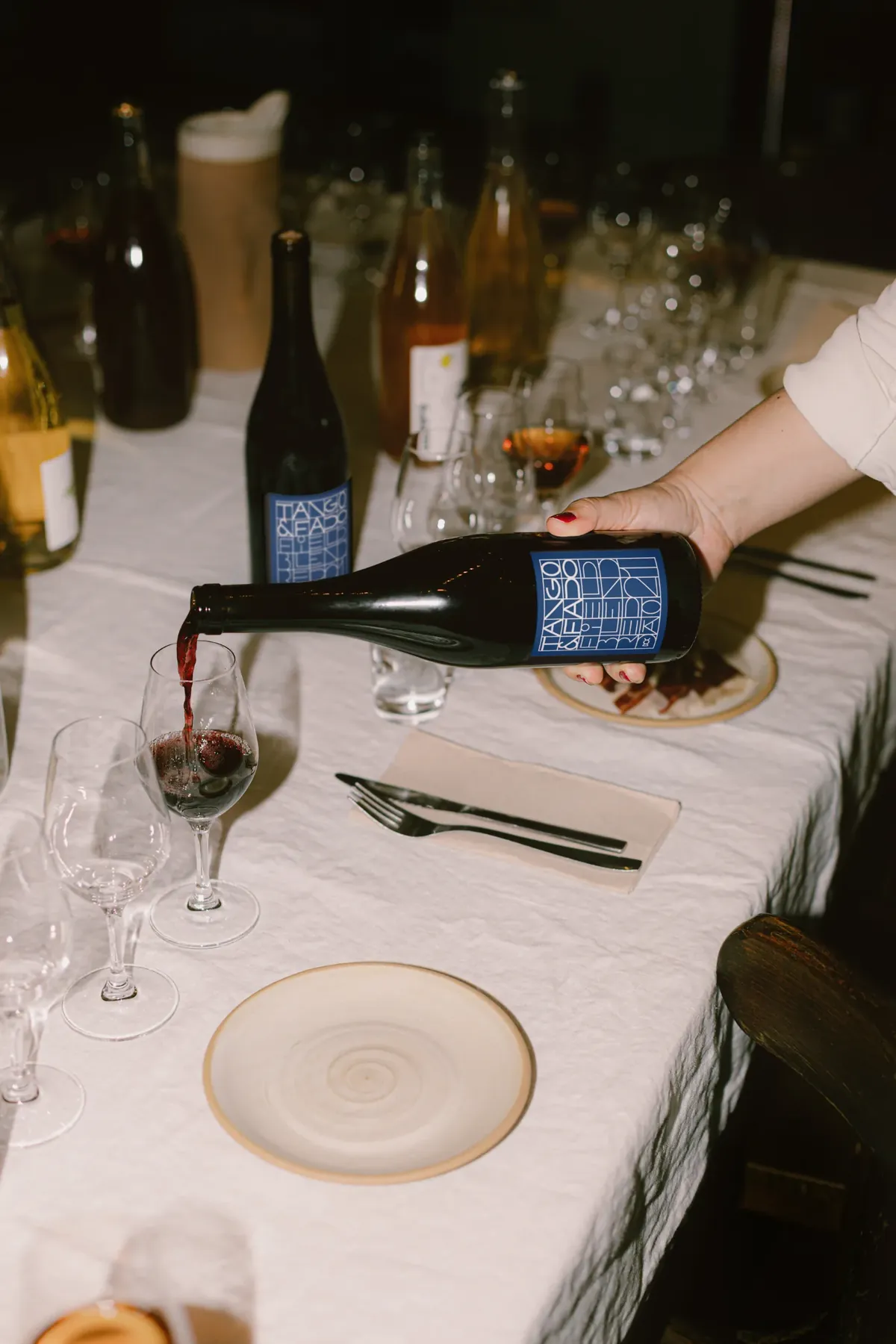 Wine being poured during a shared meal