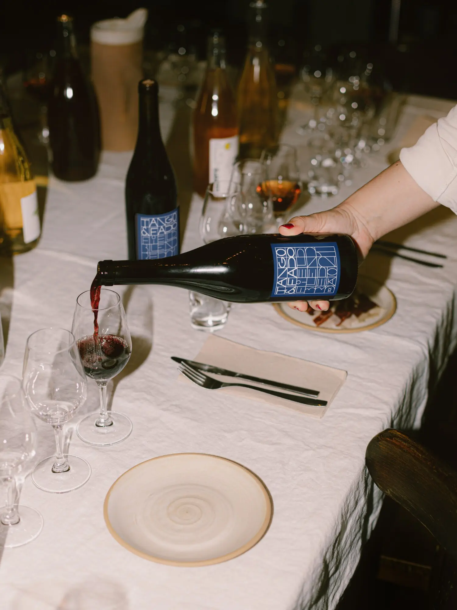 Wine being poured during a shared meal